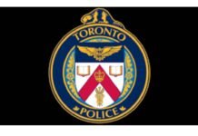 Man charged with first-degree murder after fire at downtown Toronto encampment Logo of Toronto Police
