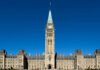 Feds to contribute money to the fight against extortion in southern Ontario Parliament Hill in Ottawa, showing the Centre Block with the Peace Tower rising in the middle, under a clear blue sky