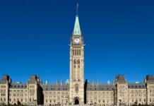Feds to contribute money to the fight against extortion in southern Ontario Parliament Hill in Ottawa, showing the Centre Block with the Peace Tower rising in the middle, under a clear blue sky