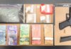 Toronto man arrested following firearm and drug investigation in downtown core Seized evidence displayed on a table, including Canadian currency in multiple denominations, clear bags containing suspected pills and powder, and a black handgun with a magazine and ammunition.