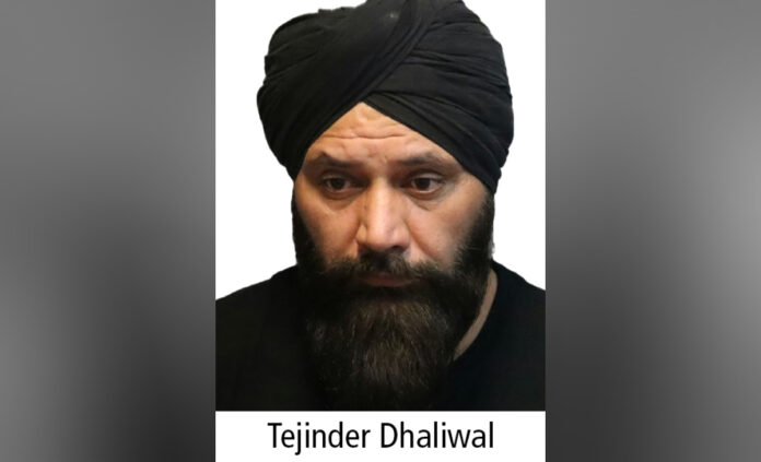 A head-and-shoulders police-released photograph of a middle-aged man wearing a dark turban and a full beard, facing the camera with a neutral expression against a plain background. The name “Tejinder Dhaliwal” appears below the image.