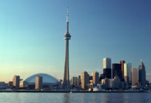 Toronto postitions itself as Canada’s top choice to host Defence Security and Resilience Bank A wide view of Toronto's waterfront skyline at sunset, with CN Tower and surrounded by downtown highrise buildings