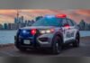 Toronto man charged in suspected hate-motivated criminal harassment case A Toronto Police Service cruiser with emergency lights flashing is parked along the waterfront at dusk, with the Toronto skyline and CN Tower visible in the background