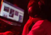 New report warns of surge in extreme online violence against children, specifically girls in Canada Red lit image with a screen