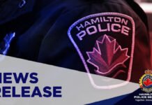Hamilton man charged after police seize suspected fentanyl at Jackson Square Hamilton Police Service news release graphic displayed on a screen, featuring the words “NEWS RELEASE” alongside a close-up of a Hamilton Police shoulder patch with a red maple leaf emblem