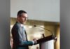 Ontario police watchdog announces provincewide police corruption probe Inspector general of Ontario Ryan Teschner in a dark suit and tie speaks at a podium with a microphone, shown in profile, addressing an audience in an indoor conference setting.