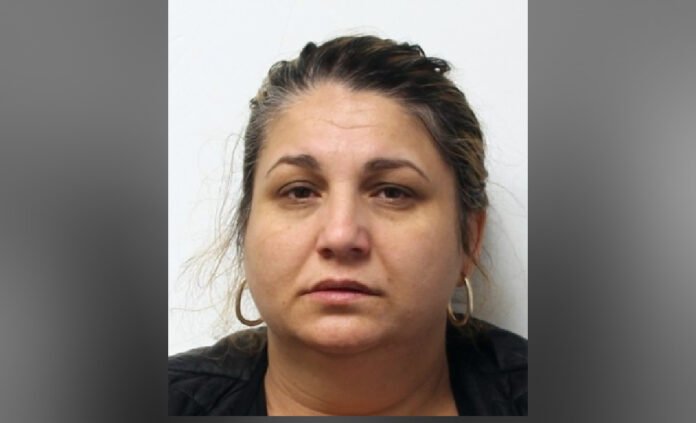 Suspect Sought in Forcible Confinement Investigation, Victoria Park Avenue and St Clair Avenue East area, Police released close-up headshot of a woman with dark hair pulled back, wearing hoop earrings and a neutral expression, photographed against a light background.