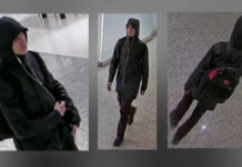 Man Wanted After Alleged Hate-Motivated Assault in Downtown Toronto Security camera images show a man wearing a black hooded winter jacket, burgundy pants, and dark shoes, carrying a black backpack with red accents and wearing white wired earbuds, walking inside an underground concourse.