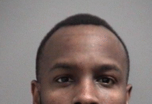 39 year old Mississauga man wanted for extensive series of break-ins Police released headshot of a person looking directly at the camera.with short hair and a beard, wearing a hoodie, against a plain grey background.