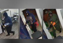 Armed robbery at Cash for Gold store in Hamilton; Police search for siupects Police released three survellence images of three supects,showing masked individuals inside a building, wearing dark clothing and gloves, moving through a doorway and interior rooms.