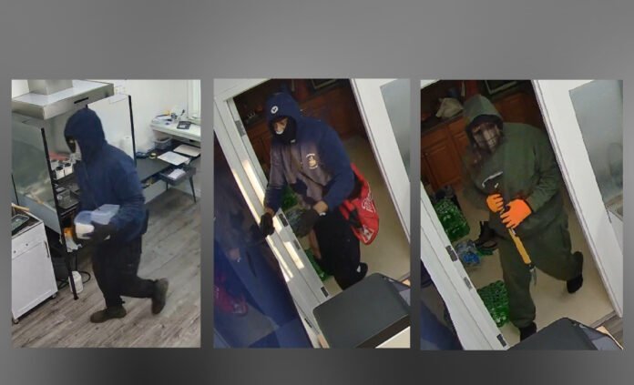 suspects_armed_robbery Police released three survellence images of three supects,showing masked individuals inside a building, wearing dark clothing and gloves, moving through a doorway and interior rooms.