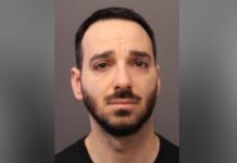 Newmarket man charged in sexual assault investigation police released headshot image of a man with short dark hair and a trimmed beard, looking straight at the camera with a neutral expression against a plain background.