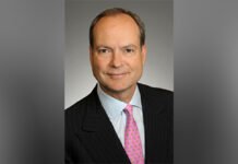 Ontario to table budget March 26, with eye to productivity, competitiveness: minister A headshot of finance minister Peter Bethlenfalvy wearing a dark suit, white shirt, and pink tie, smiling slightly while facing the camera against a neutral background.