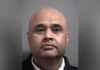 $30,000 retail theft: Brampton man charged with stealing alcohol, butter, and ghee headshot photo of a middle-aged man facing the camera. He has a shaved head, a slight moustache and stubble, and is wearing a dark jacket.