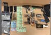 Toronto man arrested after loaded guns, drugs seized in Northwest End search Items seized during a Toronto police firearm investigation displayed on a table, including two handguns, a sawed-off shotgun, multiple magazines, boxes and loose rounds of ammunition, several smartphones, Canadian currency, marijuana in a jar and plastic bags, and other related items.