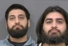 Peel Regional Police recover 13 stolen vehicles worth over $800,000, two brothers charged Two side-by-side police released images showing two adult men with dark hair and full beards looking straight at the camera against a plain background.