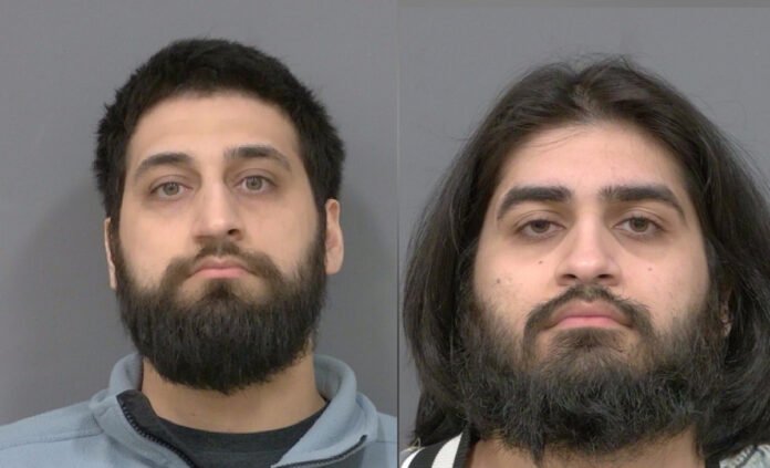 Two side-by-side police released images showing two adult men with dark hair and full beards looking straight at the camera against a plain background.