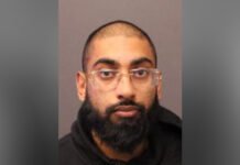 Man charged in serious Markham hit-and-run that left pedestrian critically injured Portrait of an adult man with a shaved head, full beard, and clear glasses, facing the camera against a plain background.
