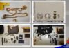 Public tip leads to arrest of Brampton man in East Mountain break-and-enter investigation A four-panel police evidence display showing items believed to be recovered property. The top-left image shows two gold-coloured chain necklaces and a ring placed on a white surface beside a yellow evidence marker. The top-right image shows several watches and circular jewellery pieces arranged next to a measurement scale. The bottom-left image displays designer-style handbags, wallets, sunglasses, keys, and multiple wristwatches laid out in rows. The bottom-right image shows additional bags, jewellery, watches, and personal accessories arranged for documentation.