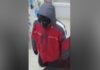 York Regional Police search for suspect after armed robbery in Richmond Hill Survellance image of man released by police wearing a black ski mask, black gloves, a red jacket and black shoes with white soles