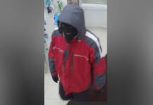 York Regional Police search for suspect after armed robbery in Richmond Hill Survellance image of man released by police wearing a black ski mask, black gloves, a red jacket and black shoes with white soles